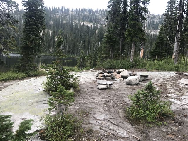 Camp site on the south side on a granite slab that slides into the lake