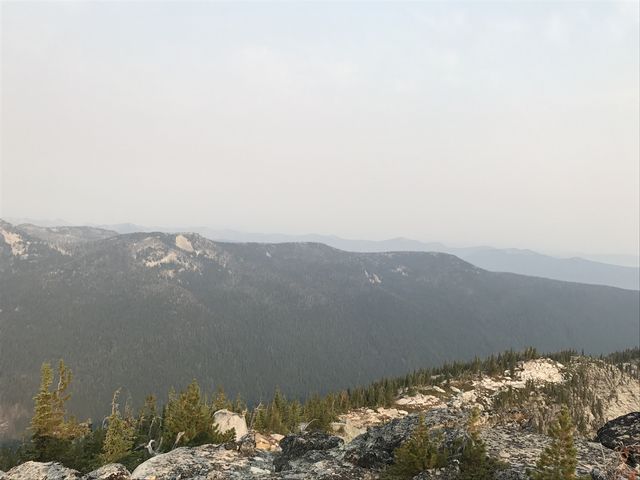 The lower Smith Ridge.That bare peak in the left third of the picture is Cutoff Peak and the wooded peak in the last third is Triangulation Smith. Both had lookout towers at some point, just as Parker Peak did