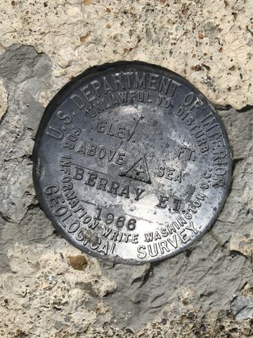 USGS marker. That would be 6,177 ft according to the USGS maps. 6,196 on the tower